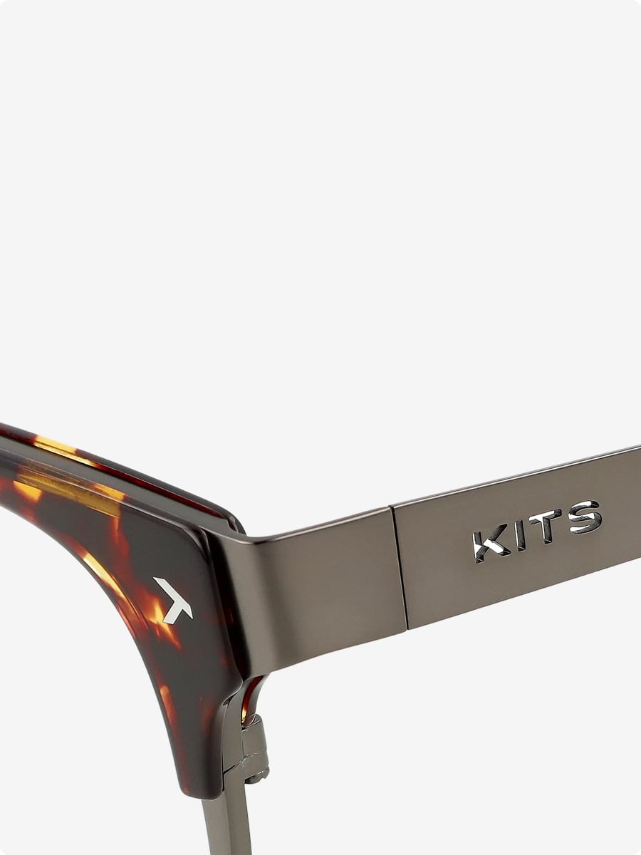 Hybrid acetate and stainless steel frame construction.